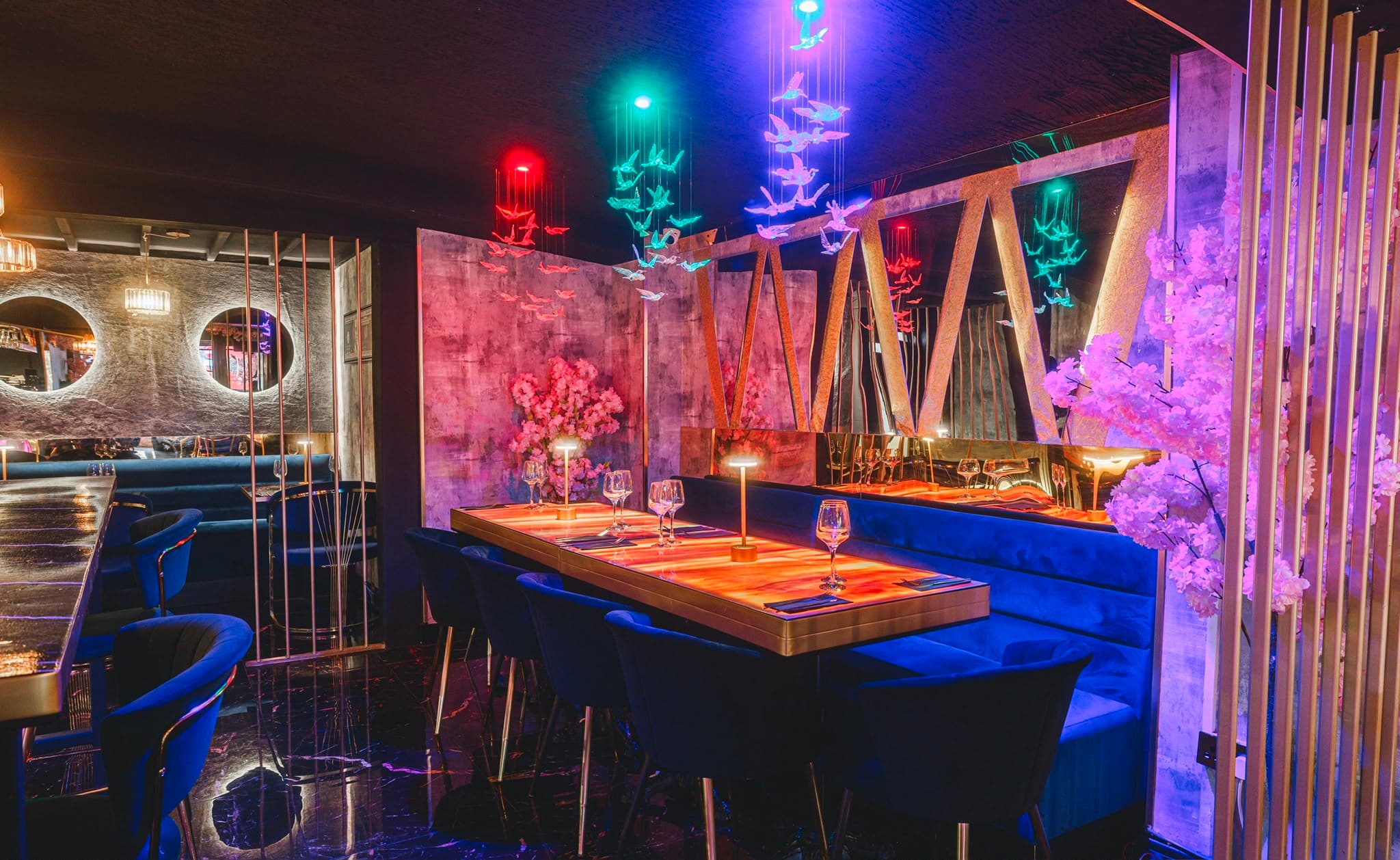Sweet1NE Chingford — neon cranes, navy booths, blossom